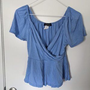 blue wrap top with flowy hem